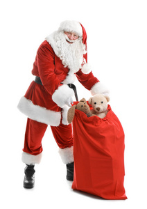 真实的圣诞老人与红色袋子充满礼物在白色背景