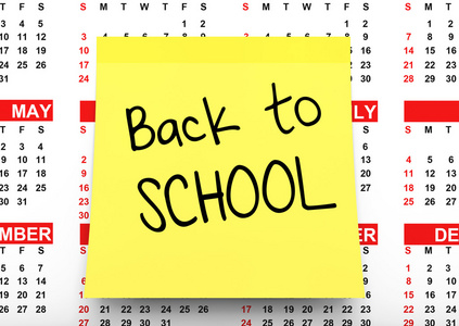 黄色便条纸背向学校标志在日历图片