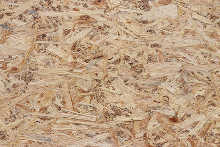 压缩轻质棕木胶合板质地.紧压木刮板表面.老木板蔗渣的背景.