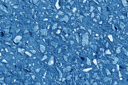 在海军蓝色调的小砂砾石堆.季节性自然背景照片