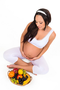 怀孕 健康和美丽。维生素和水果孕妇