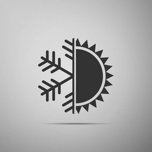 冷热符号。太阳和雪花图标在灰色背景下被隔离。冬夏象征。平面设计。矢量插图