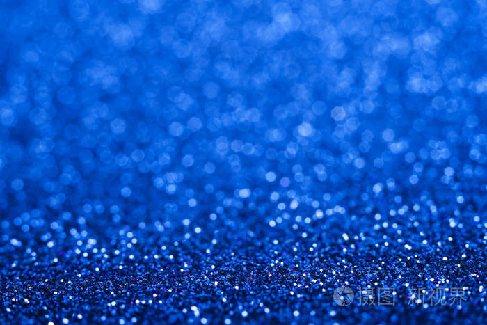 闪亮的蓝色抽象的圣诞背景.蓝色闪光