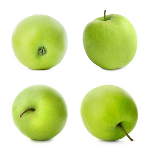 在白色背景上设置美味的绿色苹果