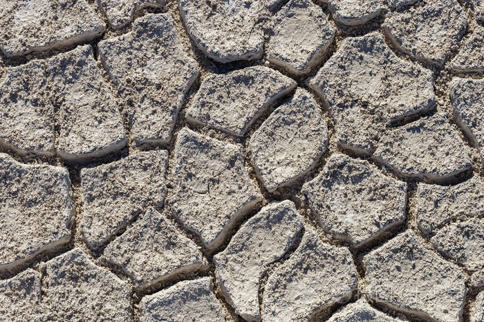 裂隙土体的顶部景观背景.盐漠在地面上的裂缝与浅颜色