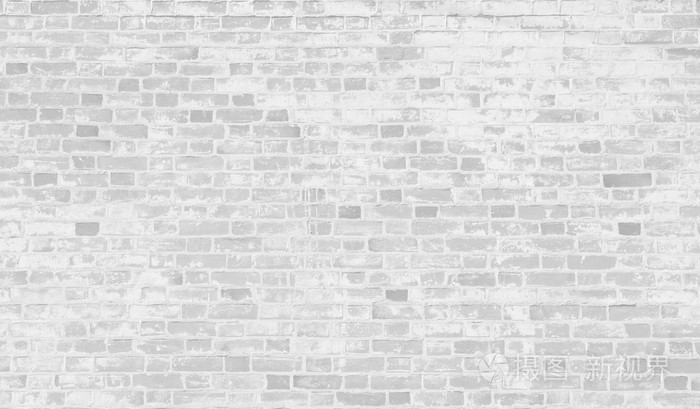 褪色的背景墙上的白砖