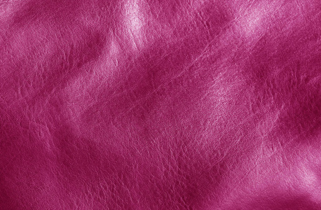自然皮革在太阳粉红色的色调。抽象背景和纹理设计