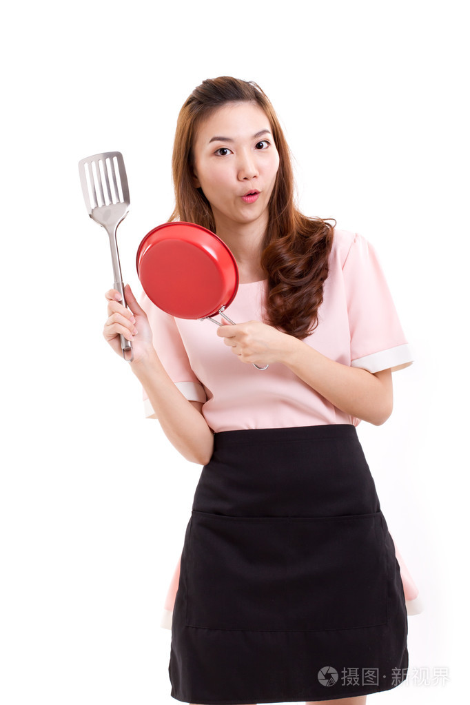 烹饪的女人或家庭主妇,手控股铲和潘