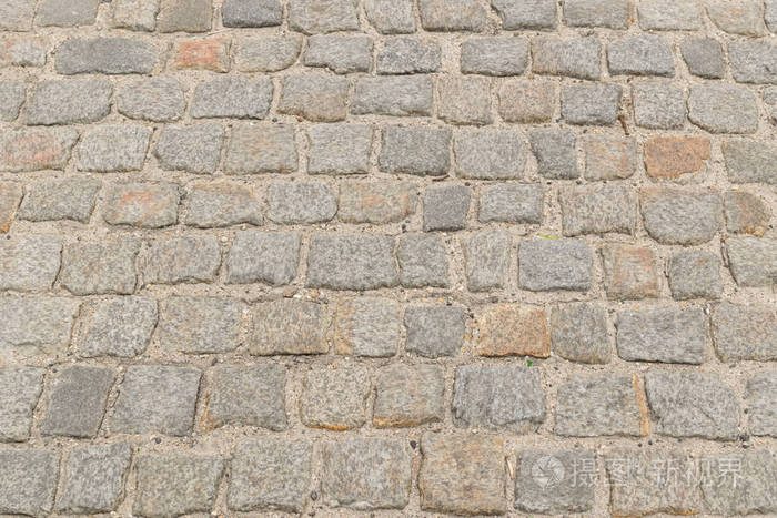 灰色旧路面顶部景观或花岗岩鹅卵石路.