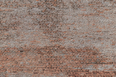 老砖墙在灰色口气与厚实的灌浆和非常粗糙, 不规则的表面