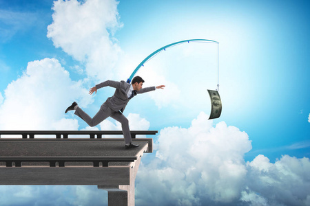 生意人追逐金钱在钓鱼竿照片