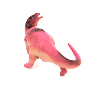 在白色背景上的淡紫色塑料恐龙玩具