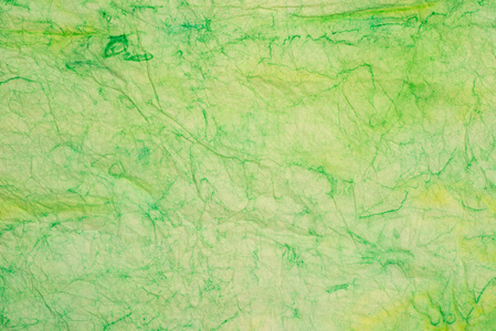 绿色折痕彩色纸巾背景纹理宏图片