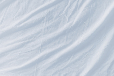 西贡巴巴皱巴巴的床床单纹理作为背景照片