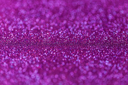 从小的亮片,特写的紫色波光粼粼背景.辉煌的背景照片