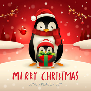 成年企鹅和小企鹅在圣诞节雪场面
