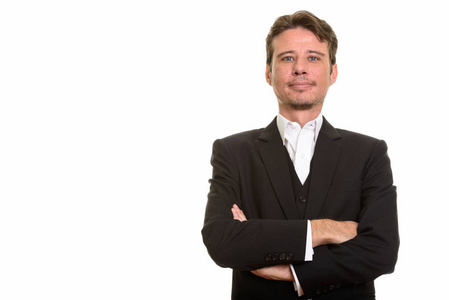 英俊的白种人商人看起来自信的双臂交叉照片