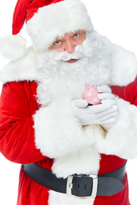 胡须圣诞老人持有存钱罐与节省隔离在白色