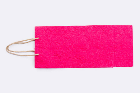带绳柄的粉红纸购物袋