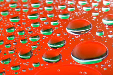抽象的橘红色背景与渐变色水滴玻璃反射 大水滴 宏