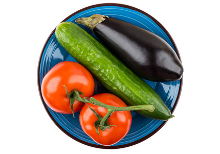 西红柿, 黄瓜和茄子在蓝色上白板照片