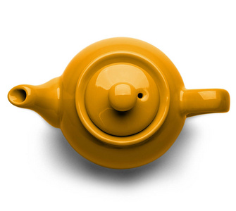 在白色的背景下,顶视图分离的橙色陶瓷茶壶照片