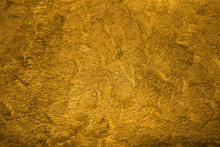 金色的金属光亮纹理背景与详细模式