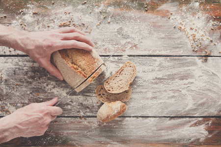 面包店概念背景。手切面包面包切片