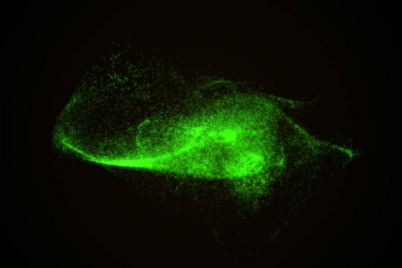 由绿色发光粒子的抽象背景
