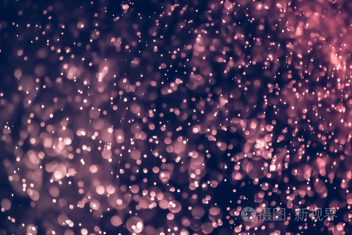 圣诞散景背景纹理抽象亮闪闪发光的明星在散景.闪光复古灯背景