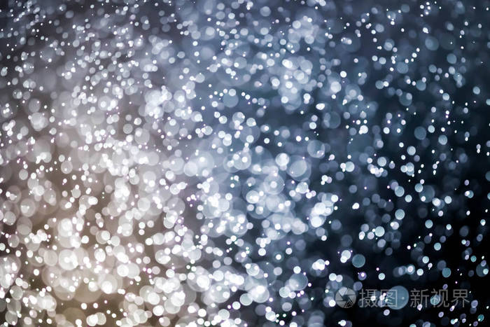 圣诞散景背景纹理抽象亮闪闪发光的明星在散景.闪光复古灯背景