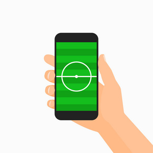 手持黑色智能手机显示足球场与两个绿色的草色调