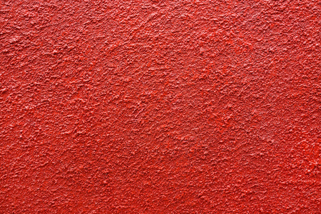 橙色的水泥墙背景红色水泥墙的质地照片