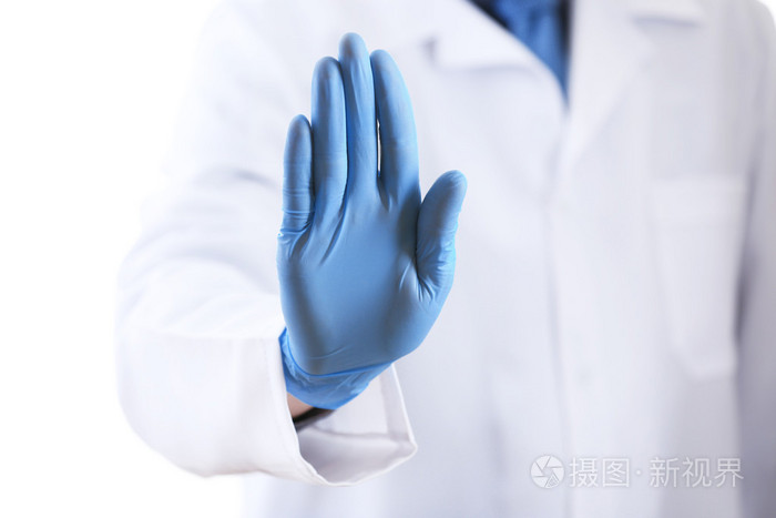 医生手中无菌手套上白色孤立