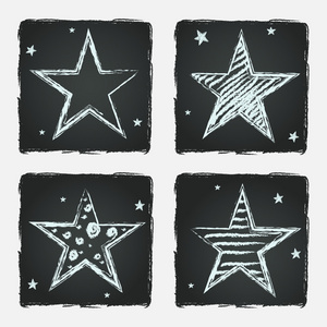 手在黑板背景上绘制的星星