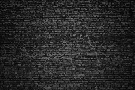 黑色的墙，砖纹理，黑暗的背景
