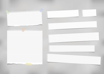 白色统治，条纹的注字，笔记本纸贴用胶带在灰色的背景上
