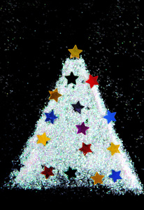 圣诞树装饰从黑色背景上的闪光