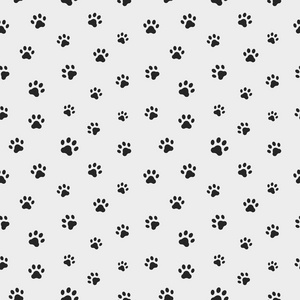 足迹猫猫的爪子的轨道.无缝的爪子足迹的动物图案.矢量照片