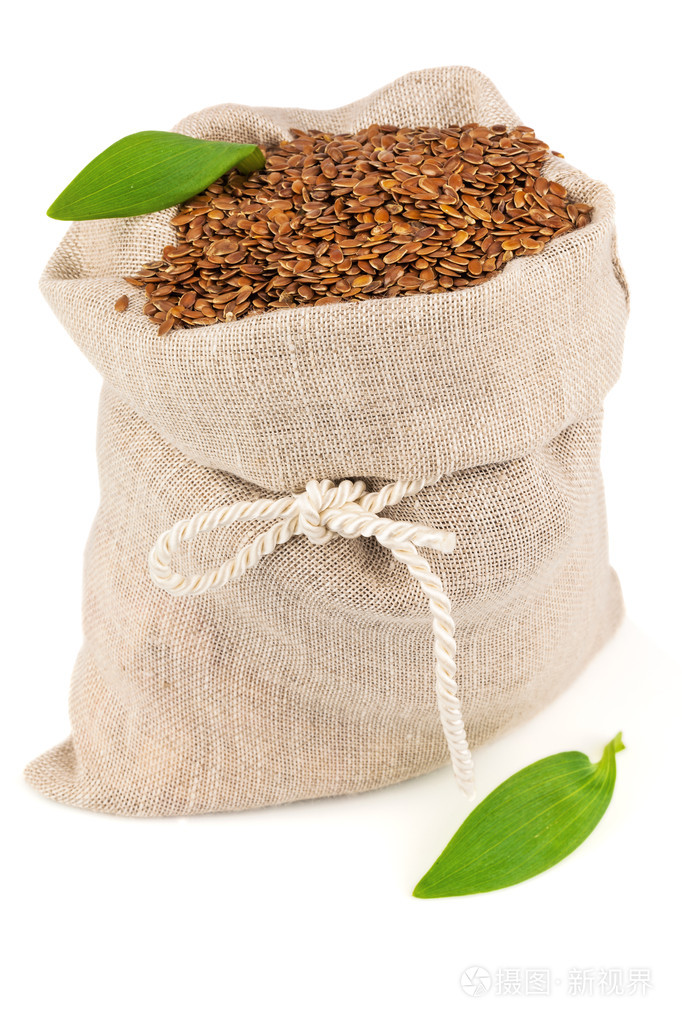麻袋的亚麻籽与叶
