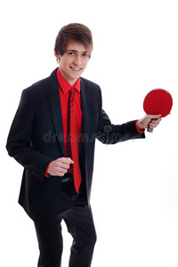 年轻笑脸商人西装革履打乒乓球图片