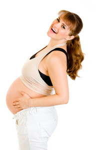 快乐孕妇举行她的肚子上白色隔离