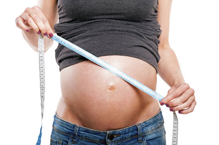 怀孕女性测量腹部，身体的一部分，照顾孩子，肚子寺
