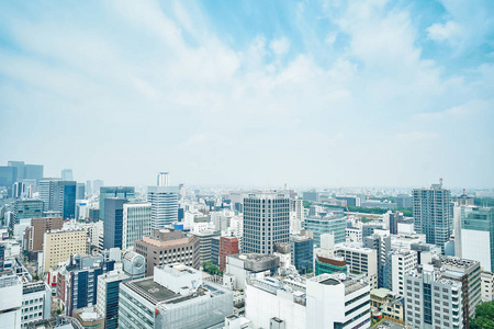 房地产和企业建设现代城市全景的天际线空中鸟瞰戏剧性云和早晨明亮的蓝天上在日本名古屋的名古屋电视塔下的经营理念