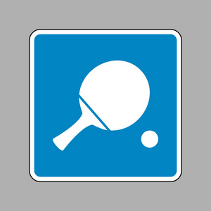 乒乓球拍球.对作为背景的蓝色标志的白色图标照片