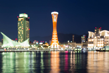 用夜间反射模糊的灯神户港口城市