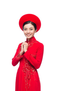 越南女子在 Ao Dai 礼服与祈祷的手势，祝你好运