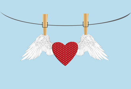 红色的心，用一根绳子上挂着的翅膀。衣服挂钩