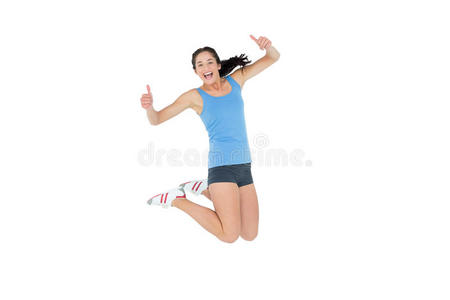 活跃的运动型女人竖起大拇指