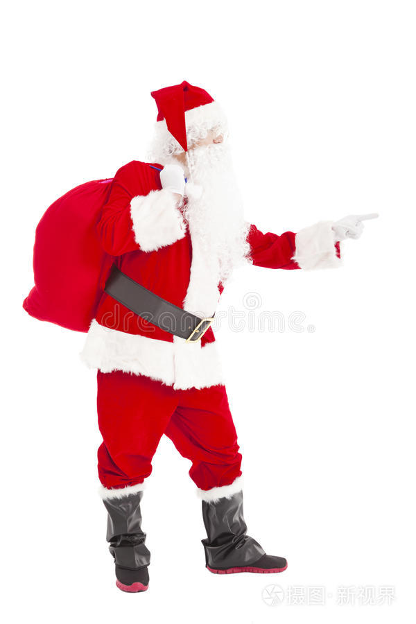 圣诞老人拿着礼品袋指着